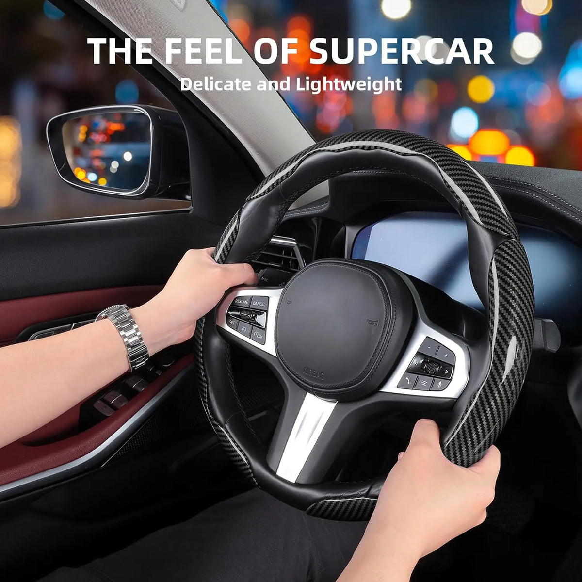 A hand grips a black carbon fiber steering wheel cover inside a car, emphasizing a delicate and lightweight feel.