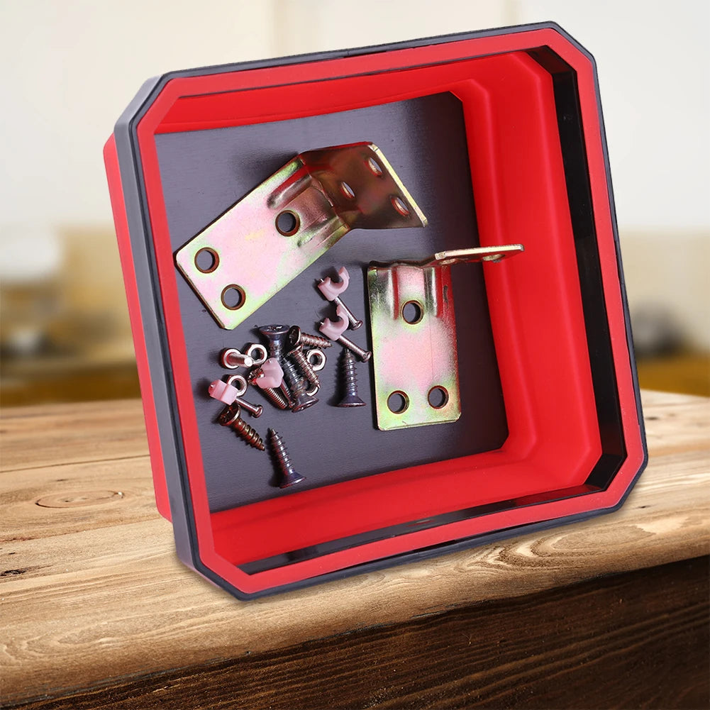 A red magnetic parts tray organizer holding various small metal hardware components like screws and pins.