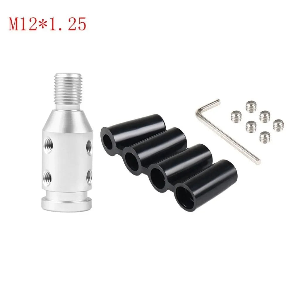 Silver M12*1.25 threaded adapter and several small metal washers and a wire clip.
