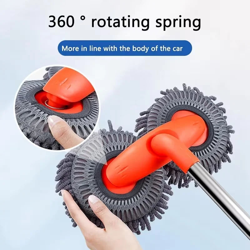An orange rotating spring cleaning brush is shown being used on a car body surface.