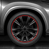 Close-up view of a car wheel with a red protective strip highlighting the rim and spokes.
