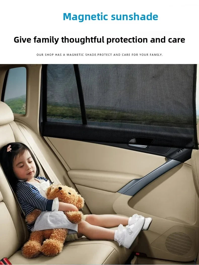 A young girl is sitting in a car seat with a teddy bear inside a magnetic sunshade on the window.