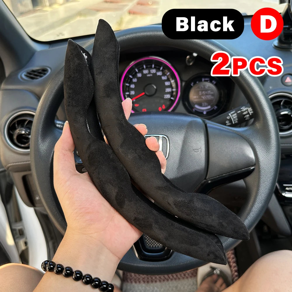 Black universal car steering wheel booster cover with two pieces shown in a car interior