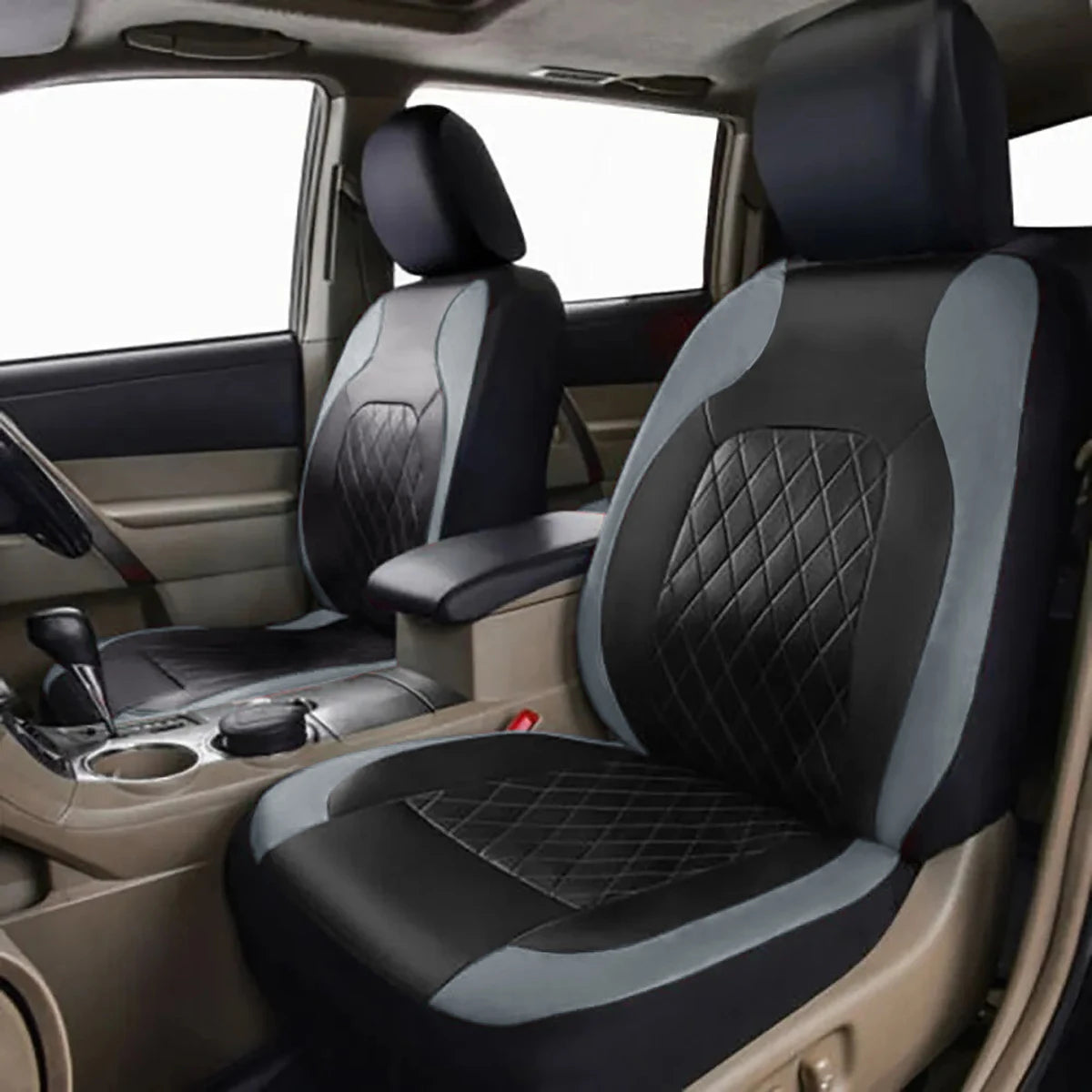 Close-up view of a black and gray PU leather car seat cover installed in a vehicle interior.
