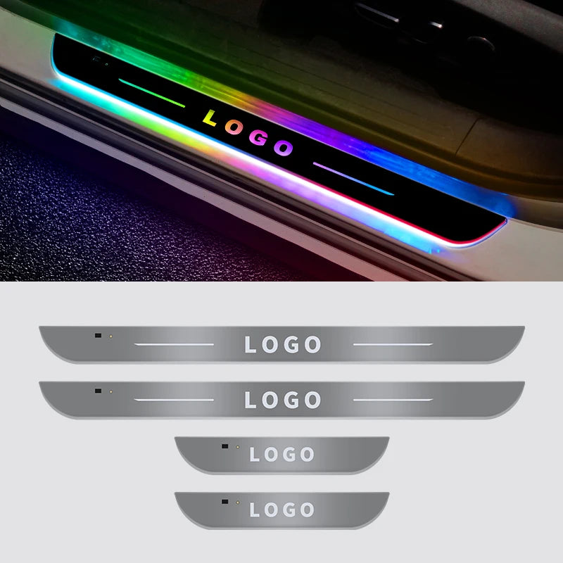 A close-up of a car door sill featuring a colorful LED light strip displaying the word LOGO.