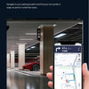A hand holds a smartphone displaying a navigation map for finding a car in a large parking area.