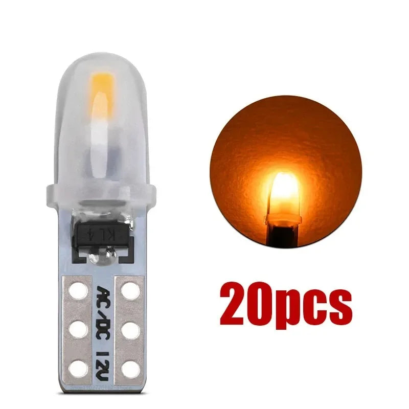 A set of 20 T5 LED dashboard and license plate bulbs, showing a single bulb and a close-up of the light.