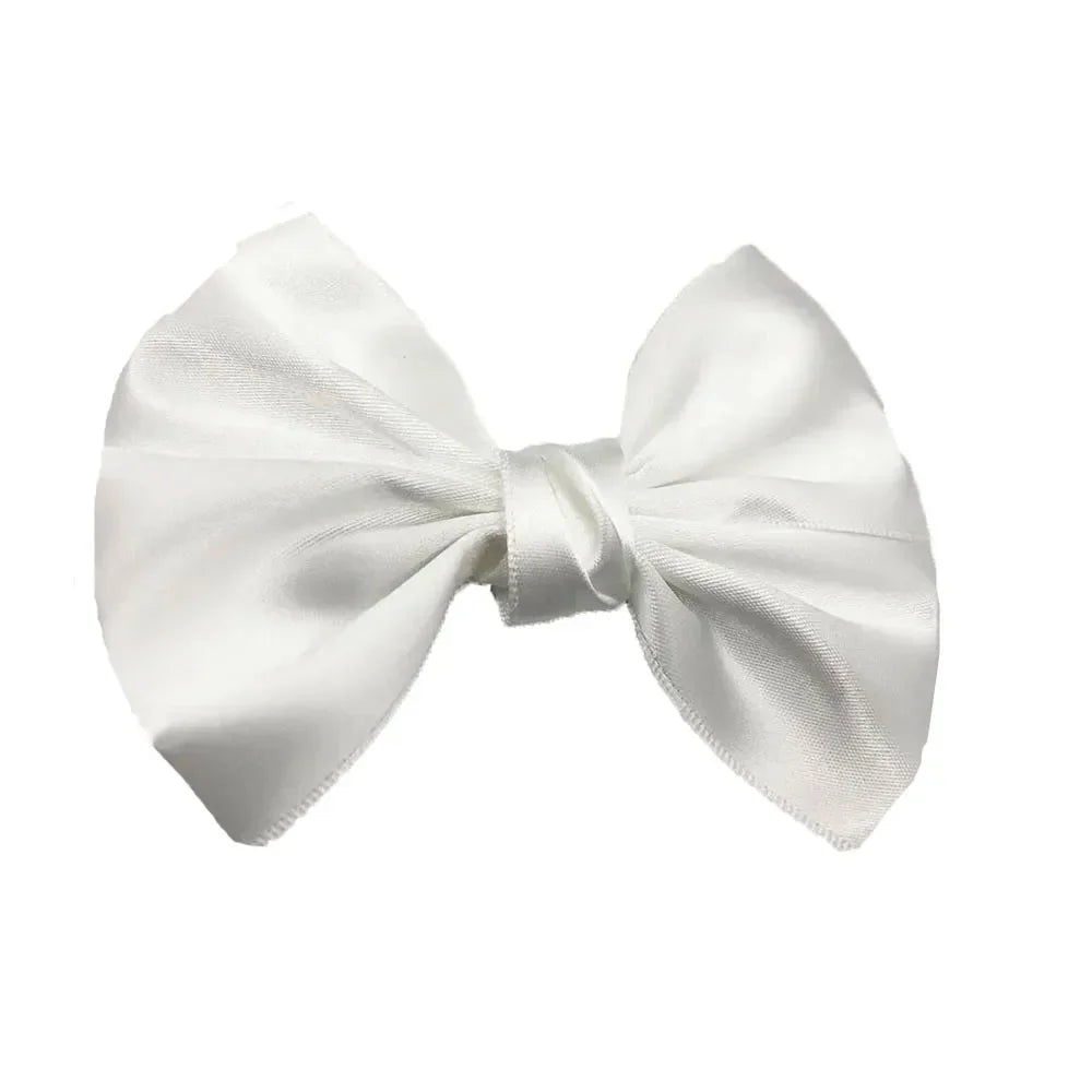 A white silk hair bow tied in a classic bow shape.