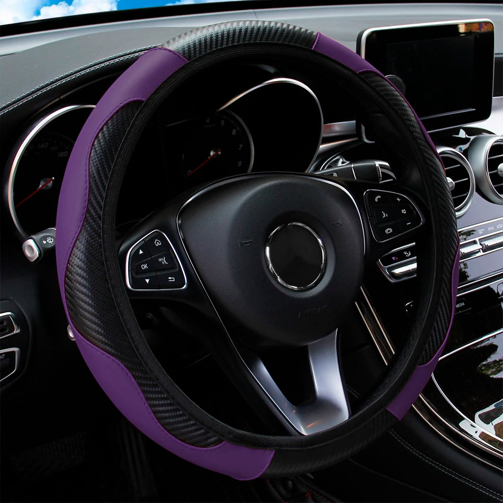 A close-up view of a black steering wheel with a purple PU carbon fiber cover inside a car interior.