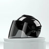 A black lightweight rainproof half helmet is displayed on a white pedestal.