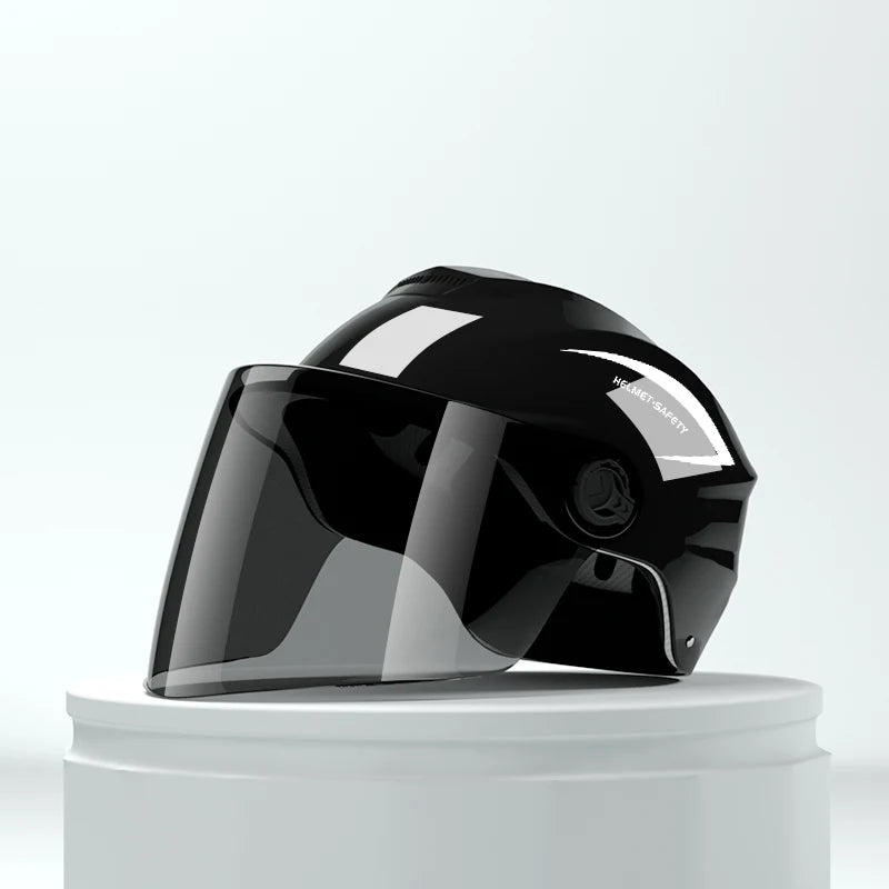 A black lightweight rainproof half helmet is displayed on a white pedestal.