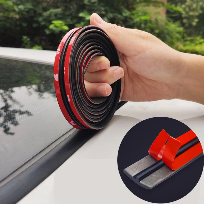 A hand is unwrapping black and red car window sealing strips, showing the coiled product.