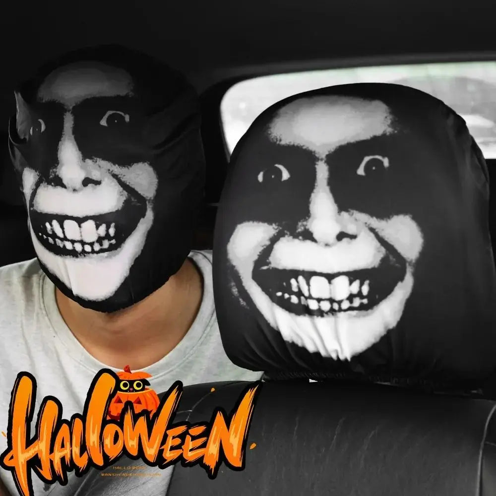 A person wearing a black face mask with a white decorative pattern, used as a car seat headrest cover.