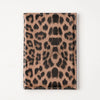 A brown leopard print passport holder with card slots.