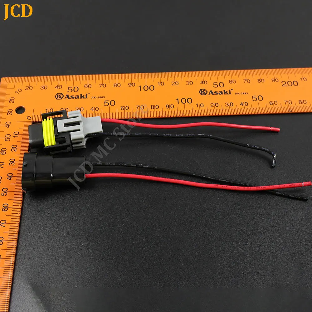 Wiring harness for an HID or LED car adapter, showing electrical wires measured against a ruler.