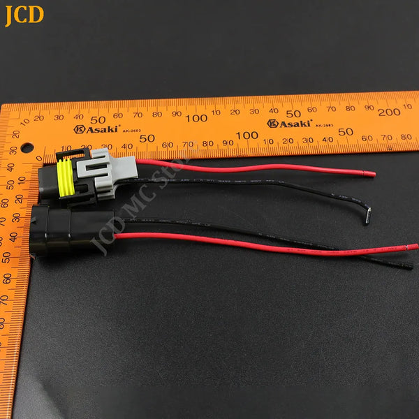 Wiring harness for an HID or LED car adapter, showing electrical wires measured against a ruler.