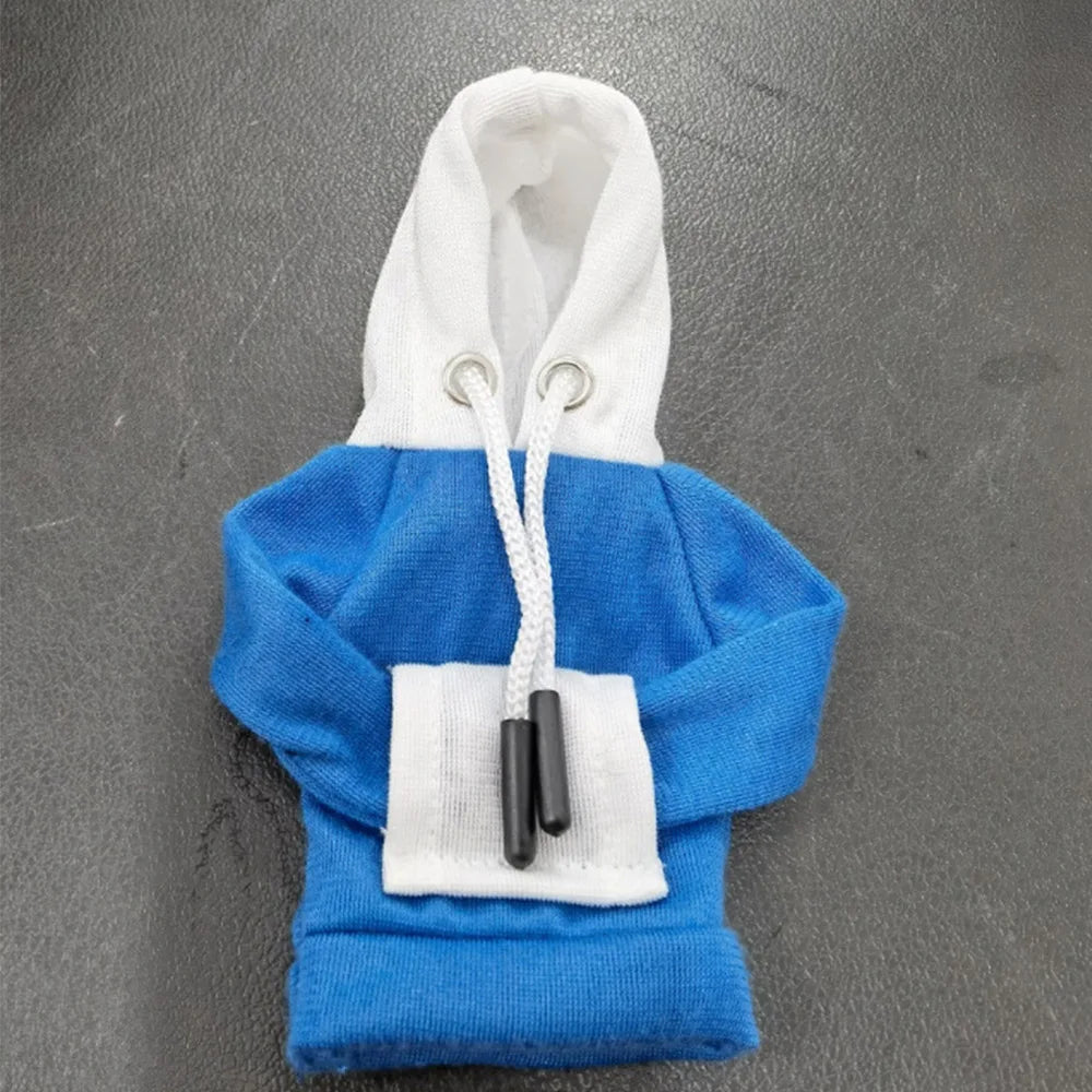 A blue hoodie with a white hood and white trim, featuring black zipper pulls.