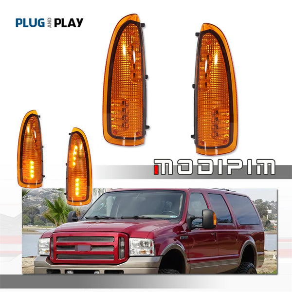 Amber LED side mirror marker lights for a red Ford Super Duty truck.