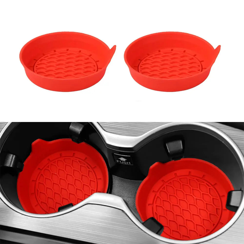 A pair of red silicone cup holder coasters shown separately and inside a car cup holder