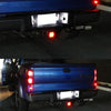 Rear view of a blue Ford truck showing high-intensity LED license plate lights.
