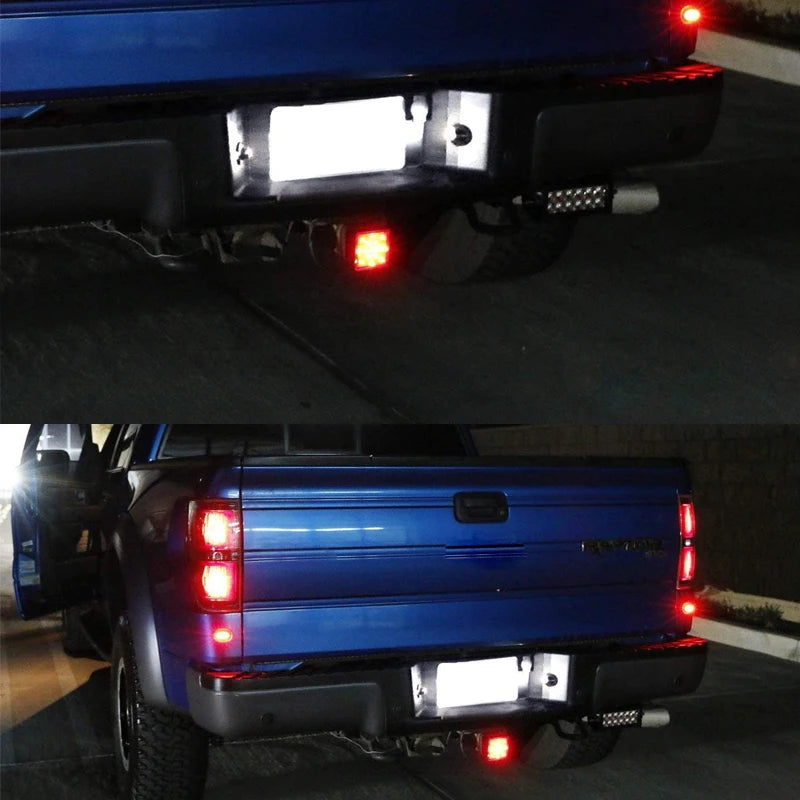 Rear view of a blue Ford truck showing high-intensity LED license plate lights.