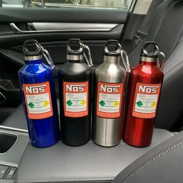 Four insulated stainless steel travel kettles in blue, black, silver, and red sitting on a car seat.
