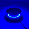 An emergency LED strobe light is shown mounted on a dark surface, emitting bright blue light.