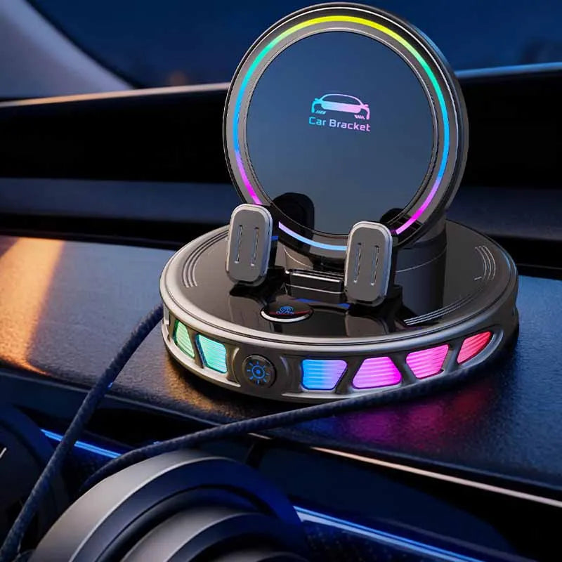 A circular car phone mount with an integrated display and surrounding RGB lighting is shown mounted in a car interior.