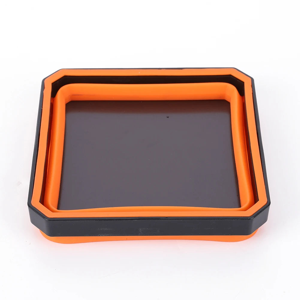 An orange plastic tray organizer with a dark insert for magnetic parts.