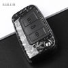 A black carbon fiber button cover for a car key, showing the electronic buttons.