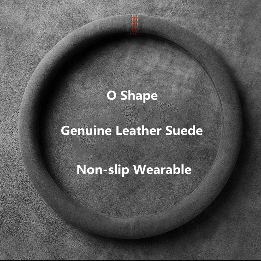 A circular black suede steering wheel cover with the O shape design for a vehicle.