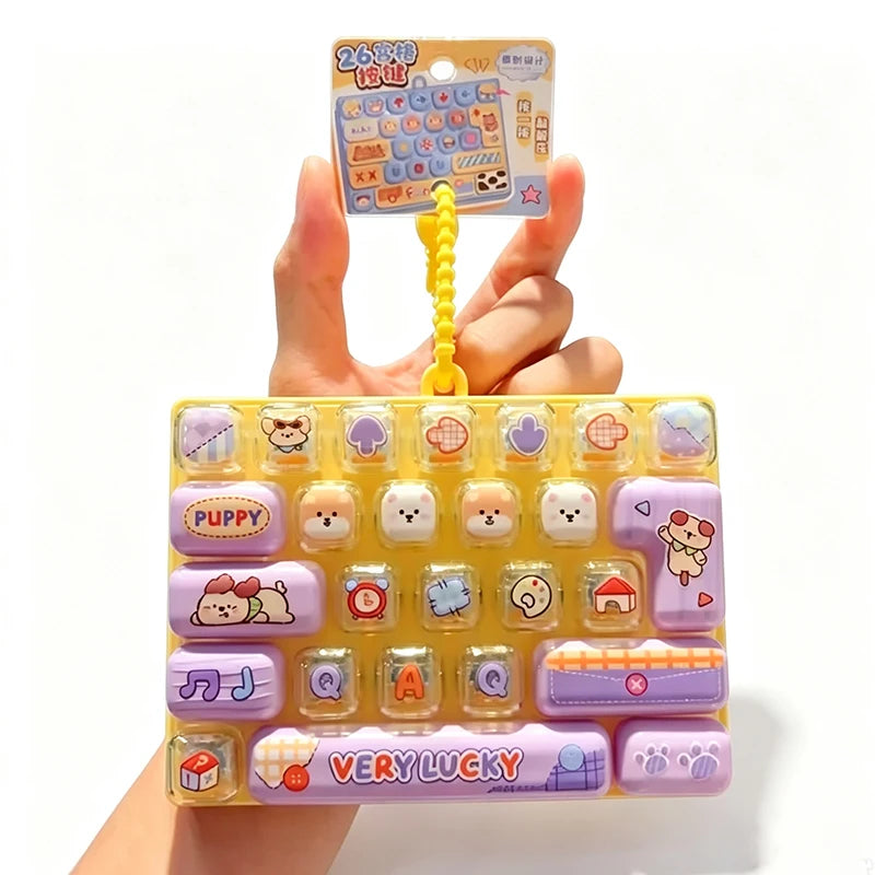 A yellow and purple set of cartoon keycap stress relief buttons with a small instruction card.