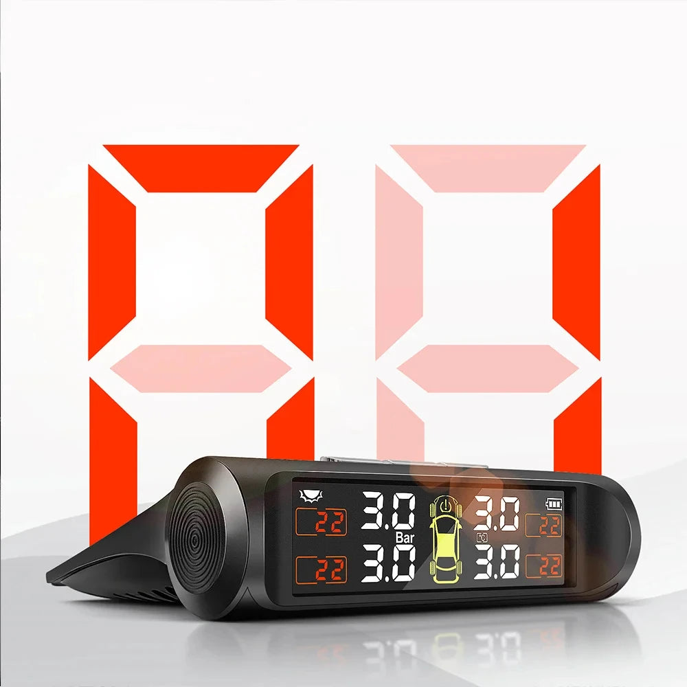 A black TPMS tire pressure monitoring system device displaying pressure readings on a white background.