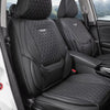 Fundas de asiento de cuero negro con costura de diamantes instaladas en el interior de un vehículo.