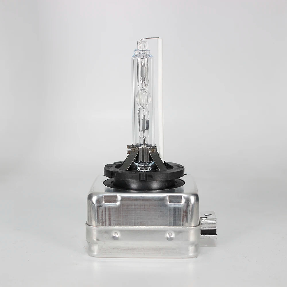 A clear glass tube containing a xenon HID bulb and its mounting base for a high-performance light source.