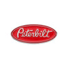 A red oval enamel lapel pin featuring the word Peterbilt in white lettering.