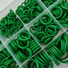A collection of green rubber O-rings and gaskets arranged in a clear plastic tray.