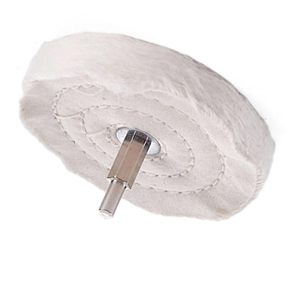A white, fibrous polishing mop wheel with a metal shaft is shown against a white background.