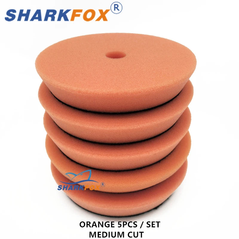 Set of five orange medium cut polishing sponge pads for car buffing