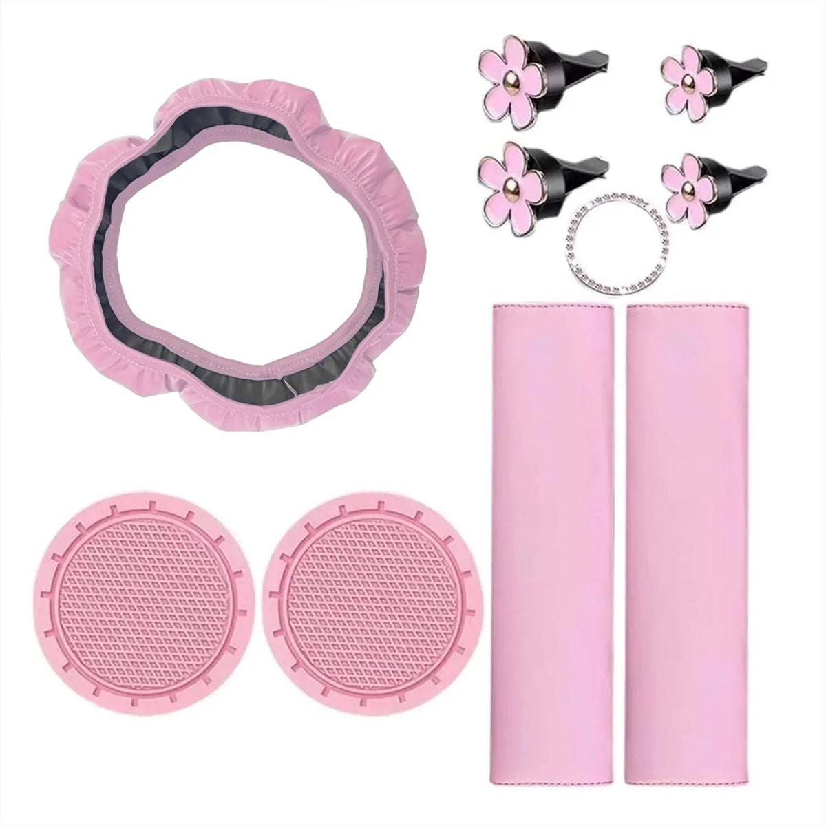 A set of pink car interior accessories including a steering wheel cover, comfort pads, and circular mats.
