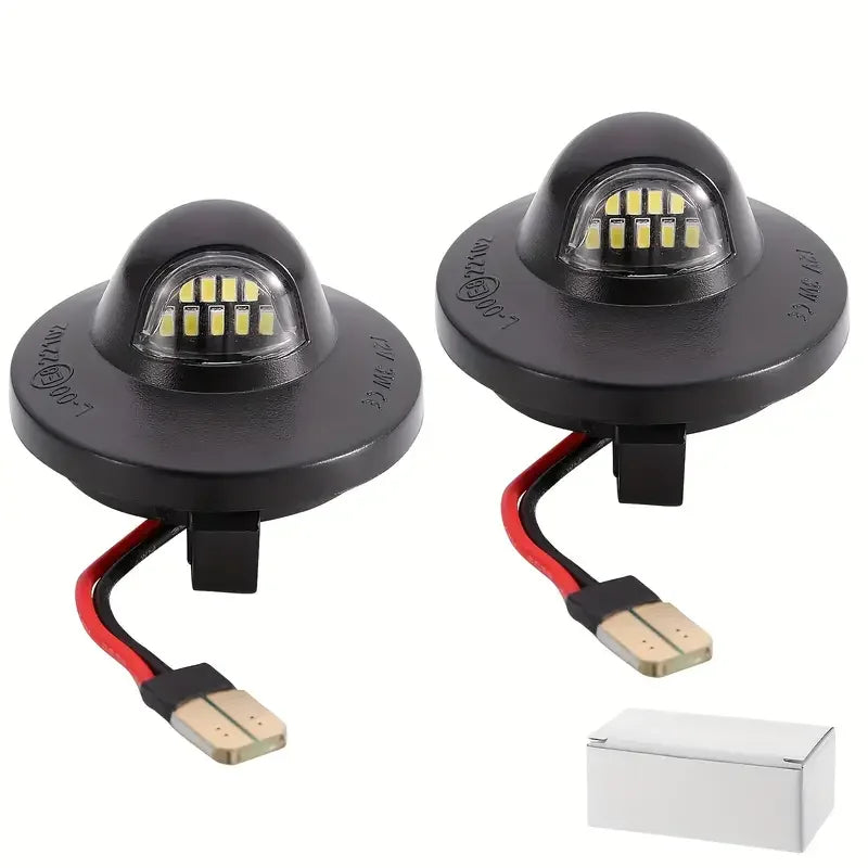 A pair of high brightness automotive LED license plate lights with black housings and wiring connectors.