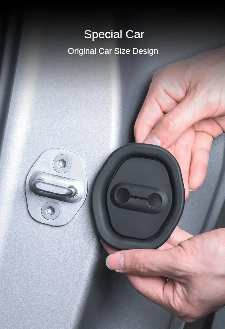 A hand is holding a black silicone car door damping guard installed on a silver car door.