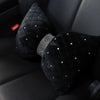 A set of black velvet car neck pillows adorned with silver diamond rhinestones.