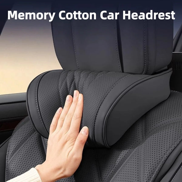A hand touches a black memory cotton car headrest on a car seat.