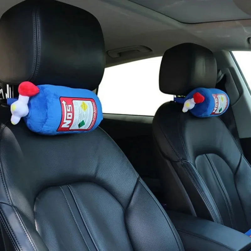 A set of blue car neck and lumbar pillows with red accents placed on black car seats.