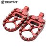 A pair of red 360° rotating wide foot pegs for motorcycles.