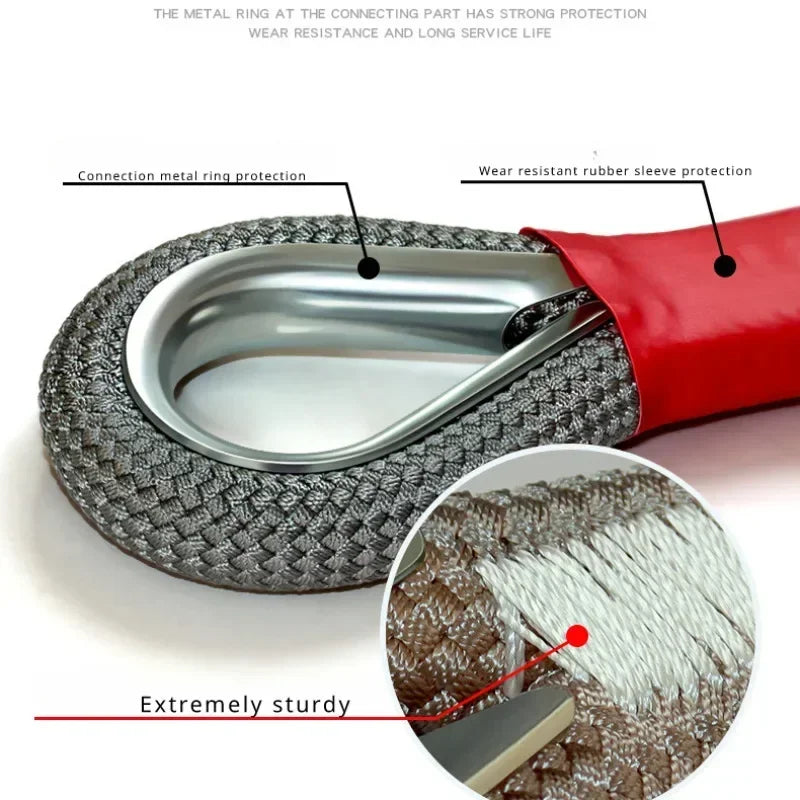 Close-up of a heavy duty towing rope featuring a metal ring and rubber sleeve protection.