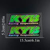Two rectangular decals featuring the KYB Racing Suspensions logo in neon green and black.