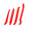 A set of red plastic tools designed for car trim removal.