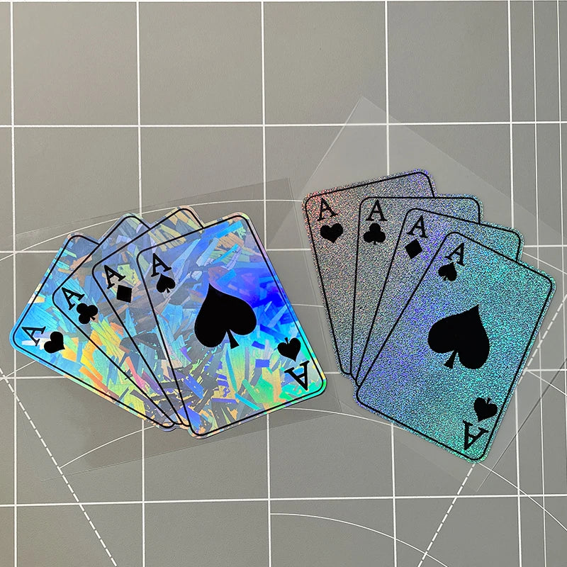 A fan of poker theme motorcycle decals showing several iridescent playing cards laid out on a grid background.